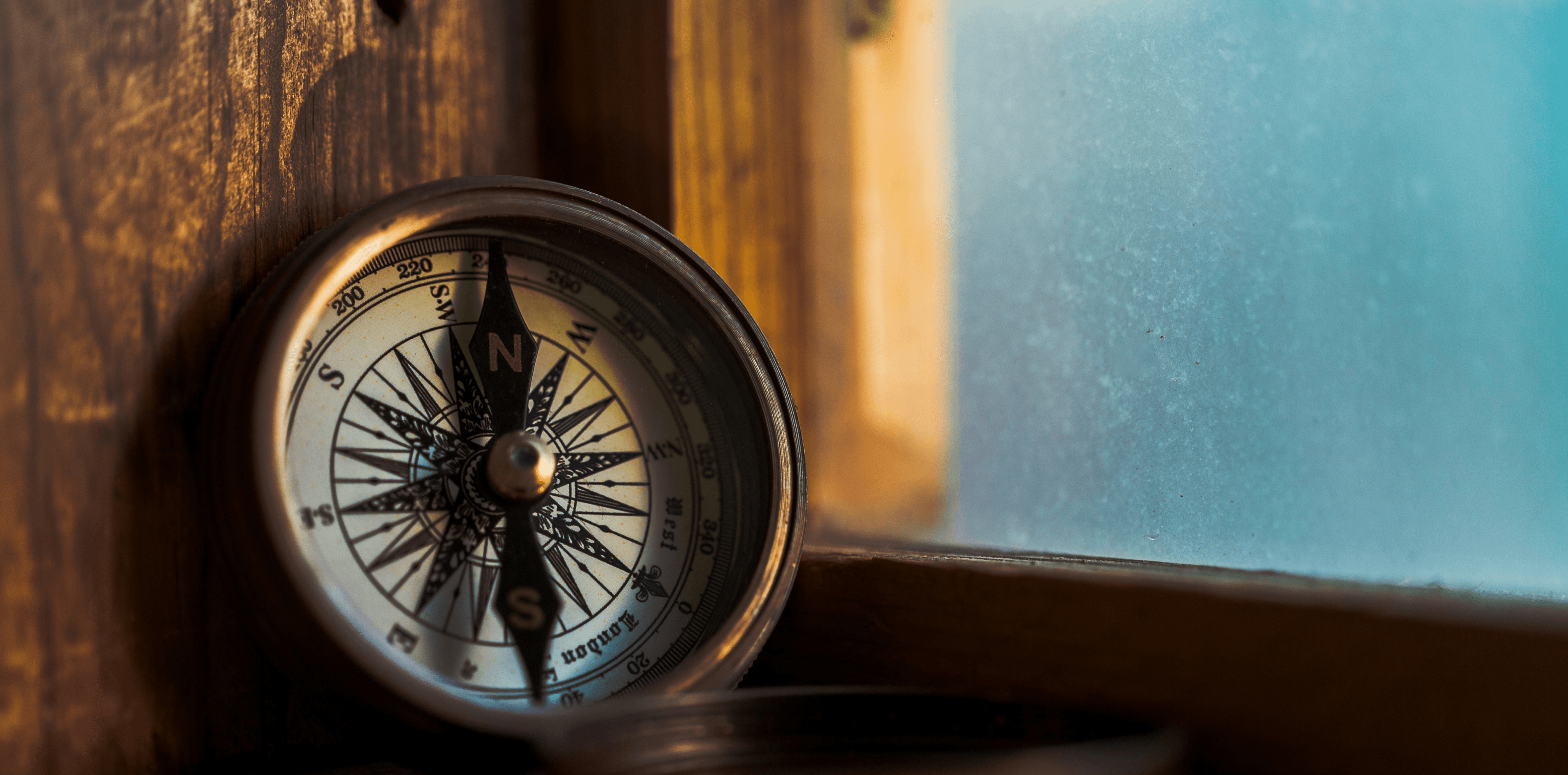 Broken compass on window seal to reflect small businesses having no clear direction for their clients visiting their website