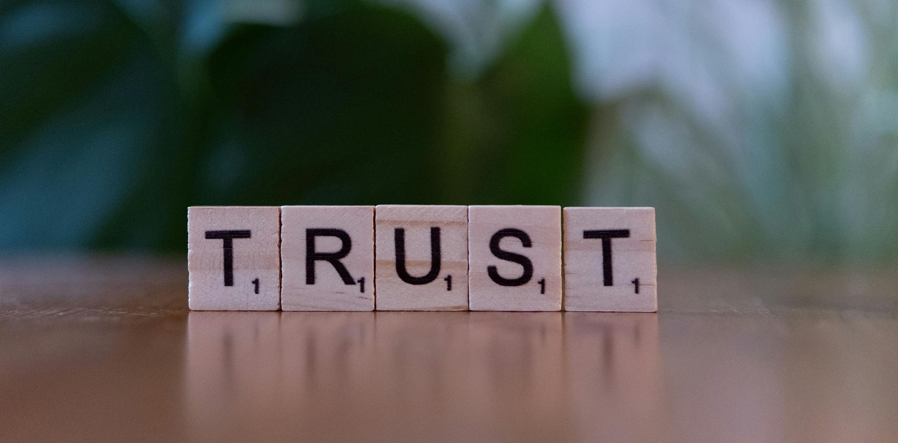 trust spelled with scrabble pieces picture